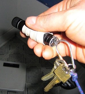 Flashlight attached to keychain.